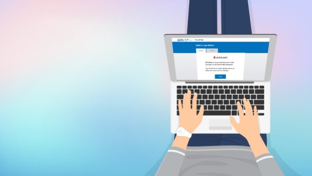 Individual inputting data on a laptop